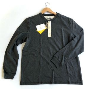 New. Long sleeve shirt. Dark gray. It's soft. It size Large.